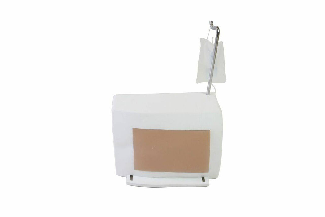 A white box with a tan panel sits on a base, featuring a small bag hanging from a metal rod.