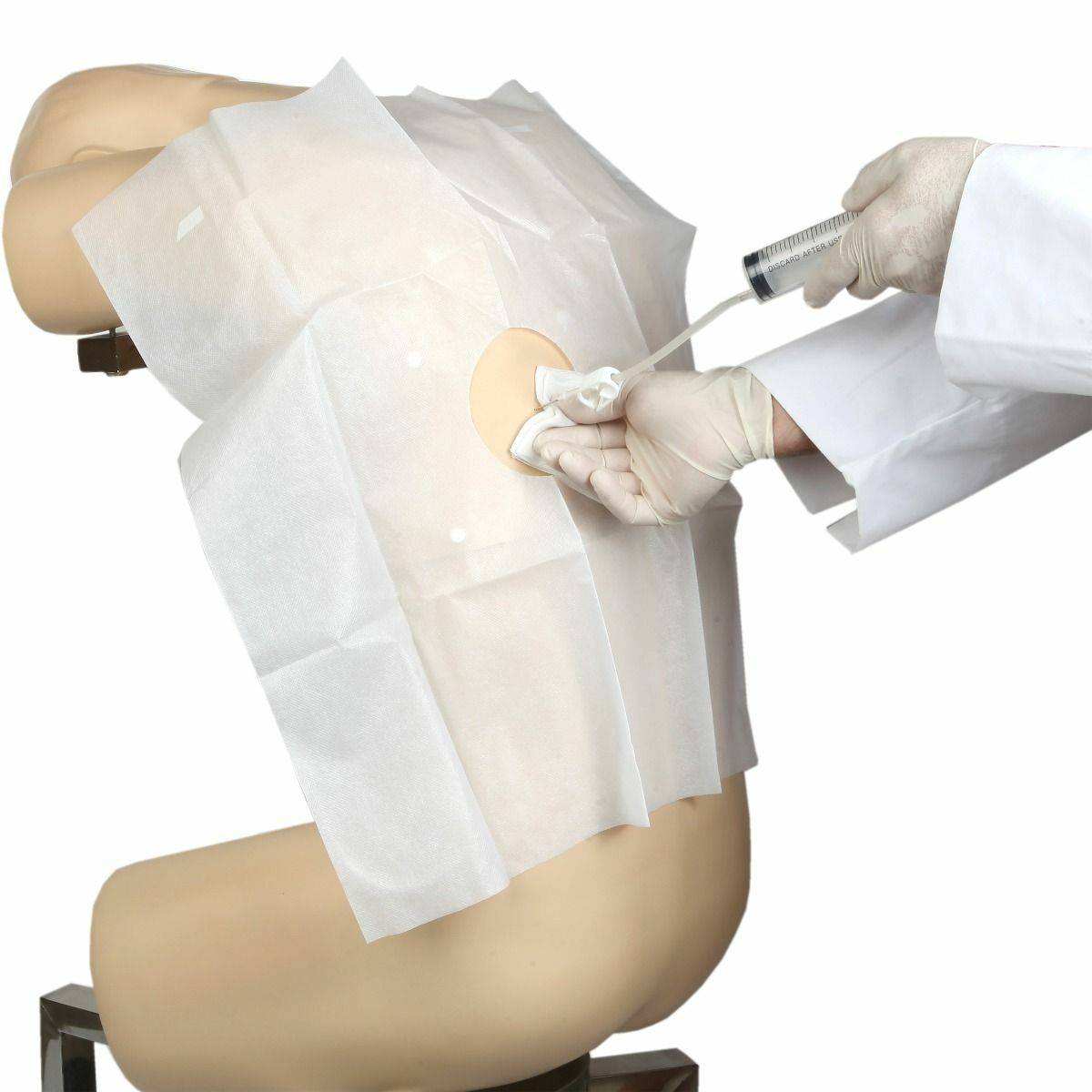 A medical drape covers a mannequin's back; a gloved hand injects fluid through a port. The procedure occurs in a sterile setting.