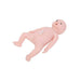 A realistic baby doll lies supine on a white background. The doll's mouth is open. A small, pale, rectangular object is affixed to its abdomen.