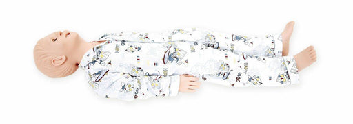 A baby lies on a white surface wearing a white, patterned sleeper.