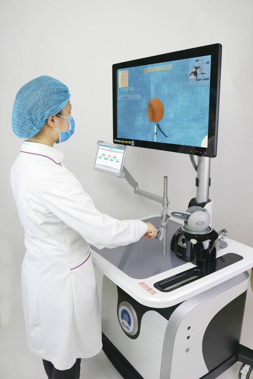 A medical professional operates a robotic surgical system. The system includes a large monitor displaying a surgical view and a control panel. The context is a medical facility. The text on the machine says: 提前到位.