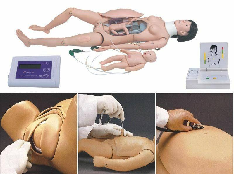 A medical training mannequin, depicting childbirth, lies on a surface. Smaller detachable mannequin components are nearby. A remote control and additional training images are also present.