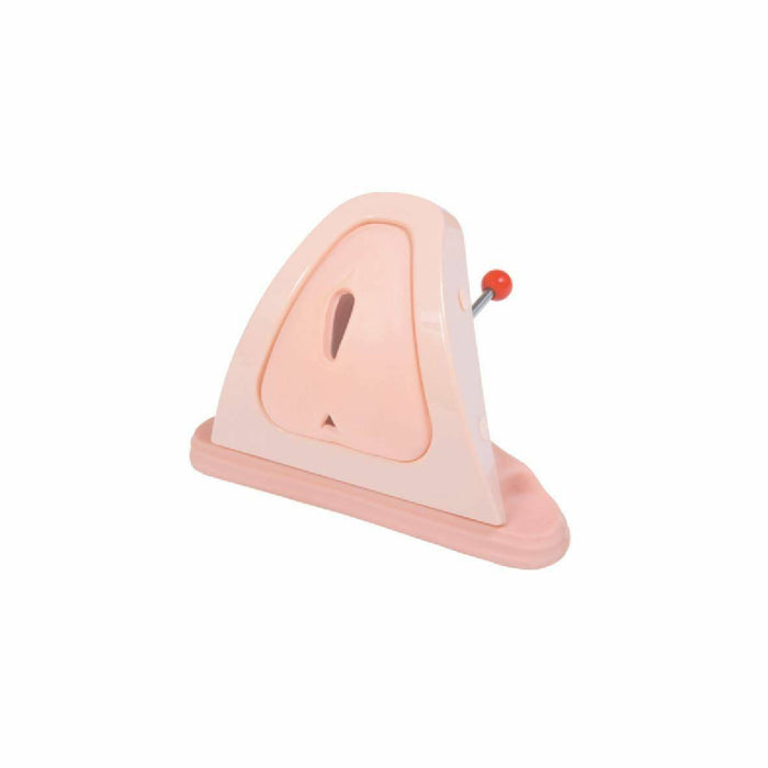 A pale pink anatomical model of a human vulva sits on a white background; a small red pin is inserted near its upper right corner.