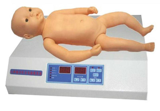 A plastic baby doll lies flat on its back on a white digital scale. The scale has a dark-colored display and button controls on the front.