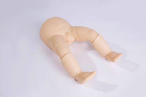 A baby doll torso and legs lie on a white surface.