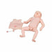 A medical training baby mannequin lies on its back. The abdomen, detached and next to the baby, shows an umbilical catheter. The mannequin is against a white background.