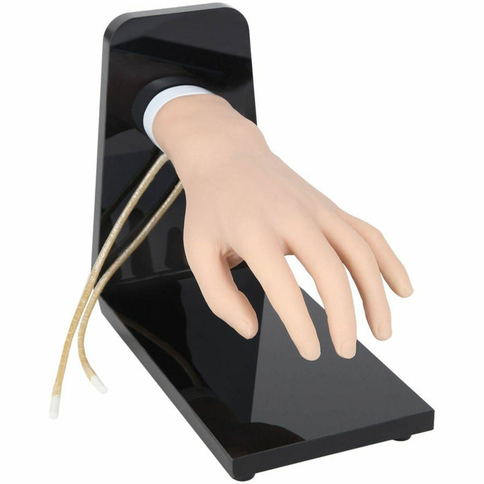 A realistic artificial hand, attached to a black base, rests on a flat surface. Two tubes extend from the base near the hand's wrist.