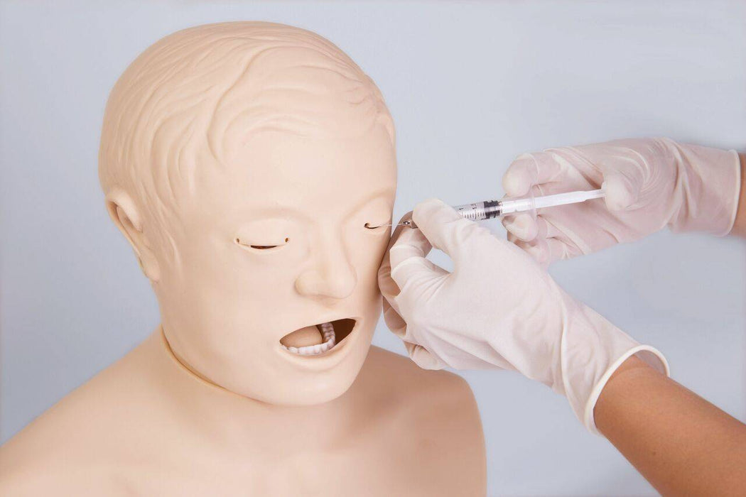 A medical dummy is being injected near the eye by hands wearing white surgical gloves, possibly in a training scenario, against a solid background.