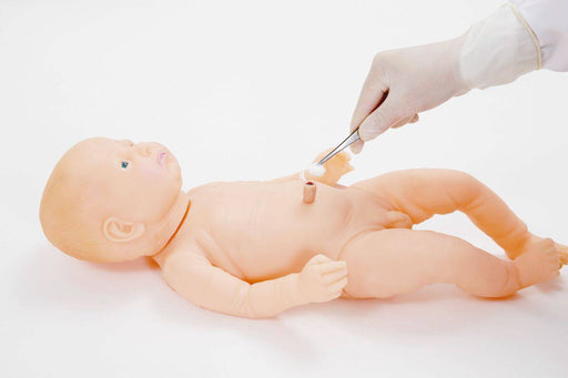 A baby mannequin lies on a white surface, while a gloved hand reaches toward its stomach with a cotton-tipped instrument, possibly cleaning the umbilical area.