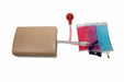A mannequin's midsection is connected via tubing to a red bulb and two bags, one with pink liquid and one with blue liquid. The bags feature clear volume measurements.