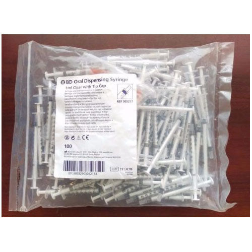 One hundred BD Oral Dispensing Syringes, 1ml clear with tip cap, are contained within a plastic bag. REF 305217.