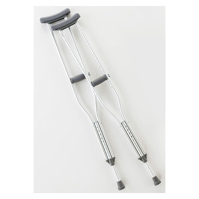 Two aluminum crutches rest on a white surface. They are positioned for use, suggesting support for mobility.