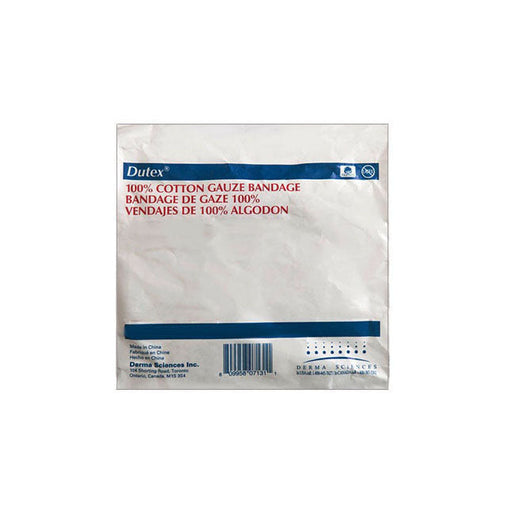 A cotton gauze bandage rests on a flat surface; it is packaged and labeled with product information and the manufacturer’s details.