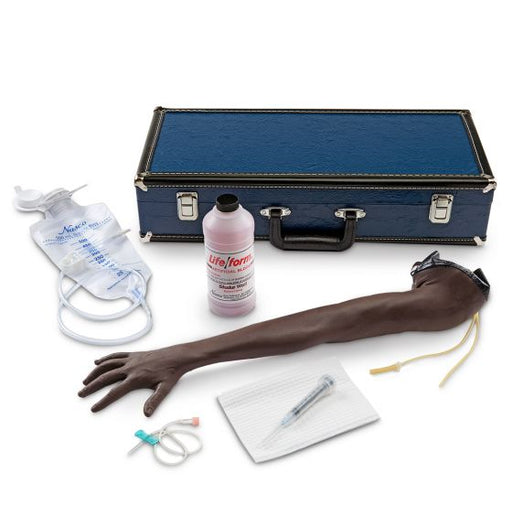 A simulated arm rests on a surface; it is accompanied by an IV bag, syringe, and other medical supplies contained within a blue carrying case. A bottle labeled "Life/form®" is also present.