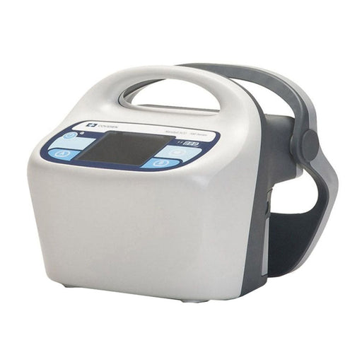 A portable medical device displays a small screen surrounded by buttons on its front face. The device has an integrated handle. Text on the device reads: “Covidien Model Acti -Vate System.”