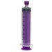 A large, purple, plastic syringe with measurements from 5-35 mL stands upright. It is positioned on a white surface.