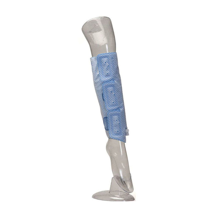 A clear plastic mannequin leg wears a blue padded compression sleeve, reaching from just above the ankle to the knee. The backdrop is a clean white.